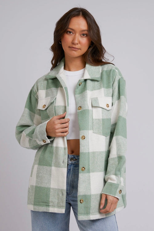 Model wears a green shacket