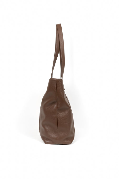 A brown leather shoulder bag with a single strap, shown from the side against a plain white background.