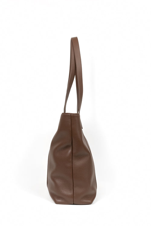 A brown pebbled leather shoulder bag shown from a side profile view against a plain white background.