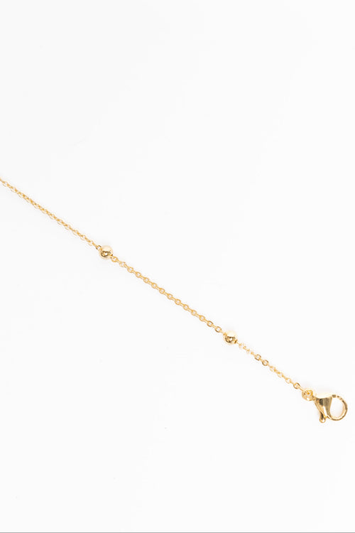 Gold necklace on a white background