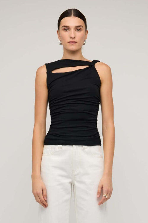 Black sleeveless top with asymmetric neckline and cutout detail, featuring a ruched body for a fitted silhouette, worn by a model against a neutral background.