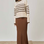 model wears a beige tan stripe knit