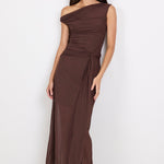 Woman wearing a brown one-shoulder dress on a white background