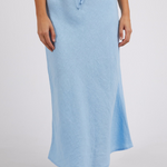 model wears blue linen maxi skirt