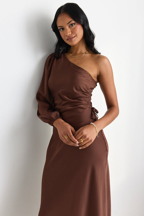 model wears a brown one shoulder midi dress