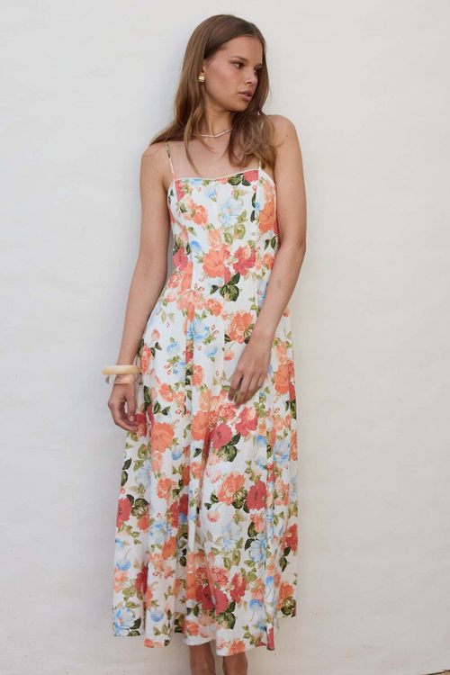 model wears orange floral midi dress