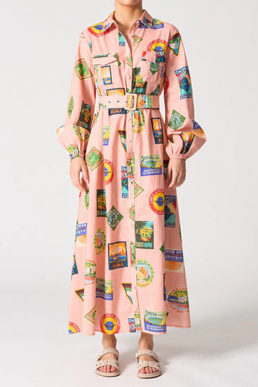 Long dress with colorful vintage-style label print on a white background
