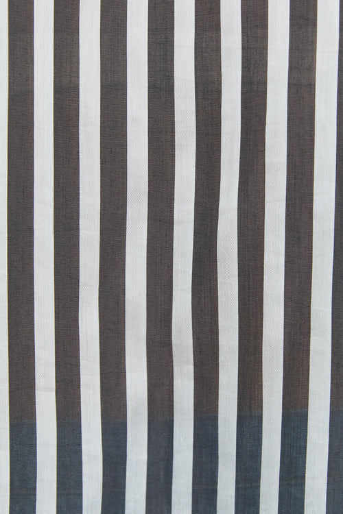 Striped fabric with alternating brown and white vertical stripes on a plain background