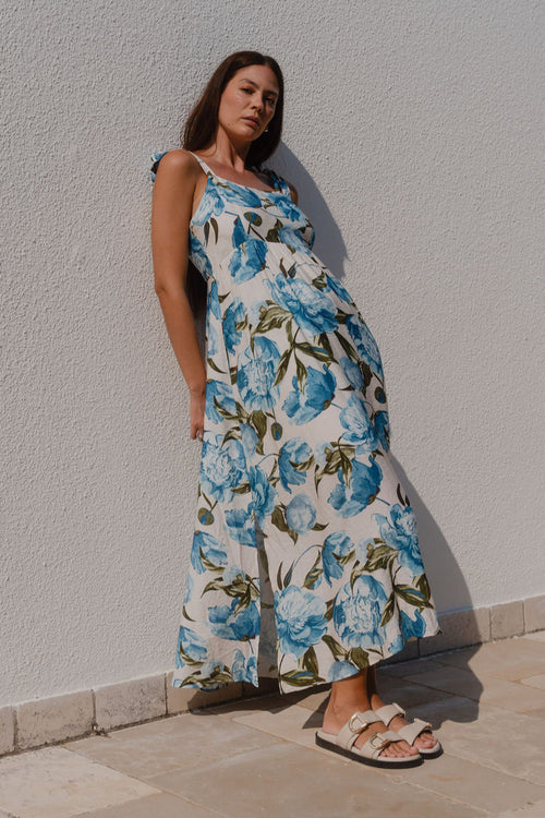 model wearing a blue floral dress