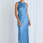 Model wears a blue satin dress