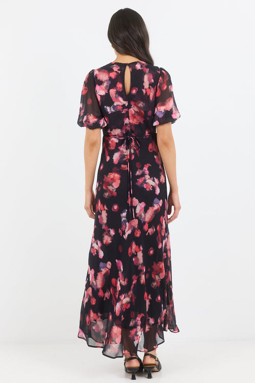 Woman wearing a floral dress on a white background