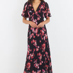 Woman wearing a floral dress on a white background