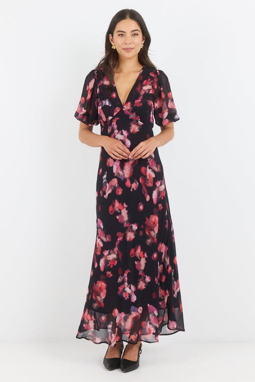 Woman wearing a floral dress on a white background