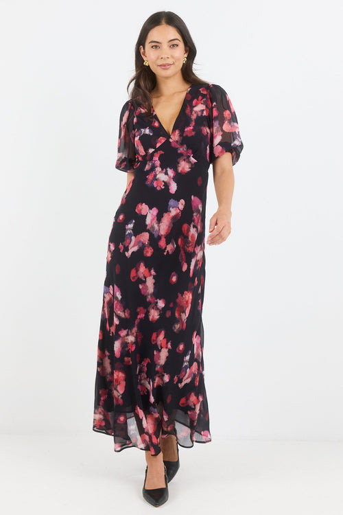 Woman wearing a floral dress on a white background