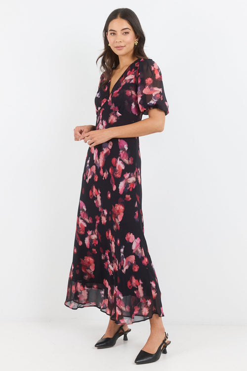 Woman wearing a floral dress on a white background
