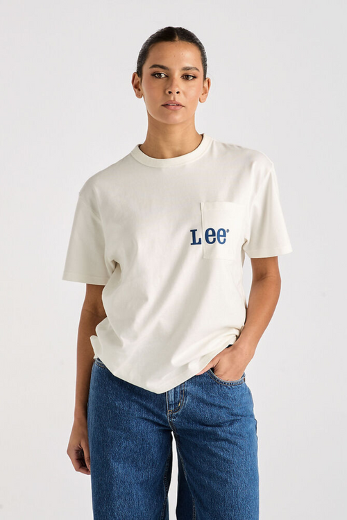 model wears white oversized tee and blue denim jeans