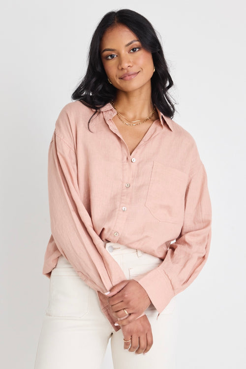 model wears a pink linen shirt