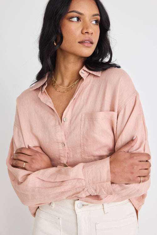 model wears a pink linen shirt