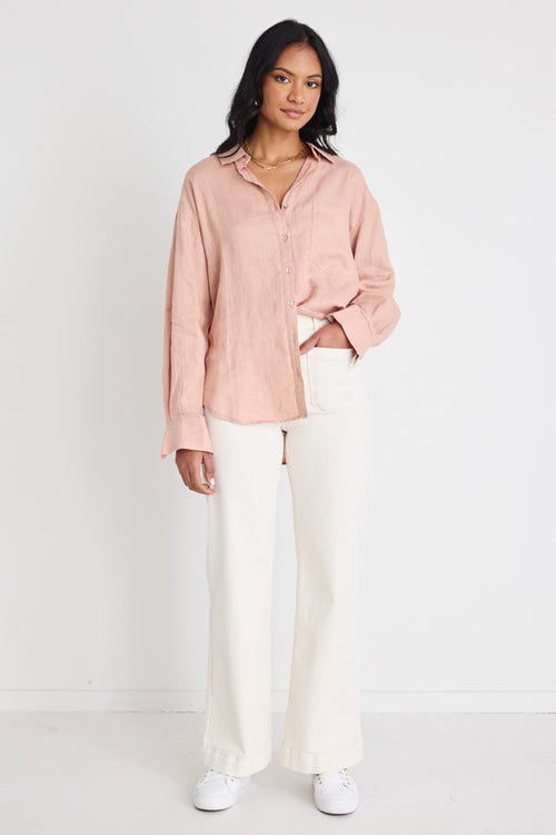 model wears a pink linen shirt