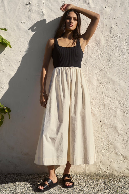 Model wearing black and ecru maxi dress