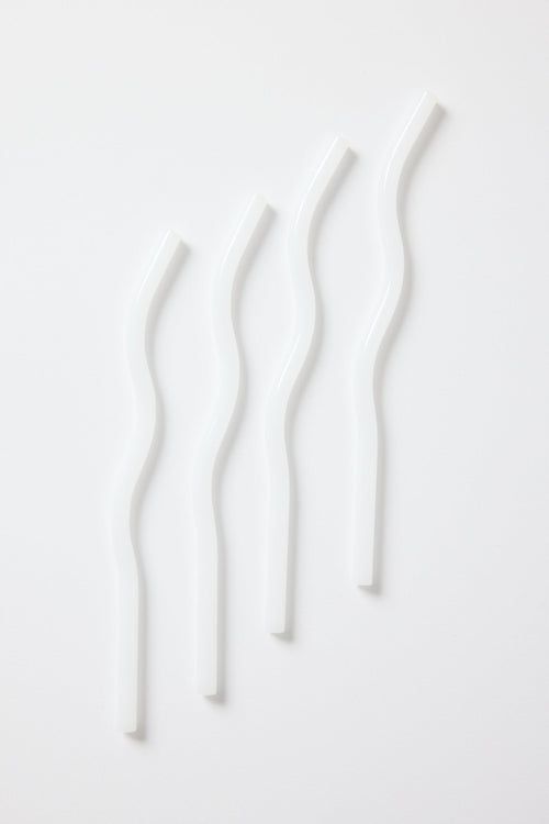 white curvy glass straws