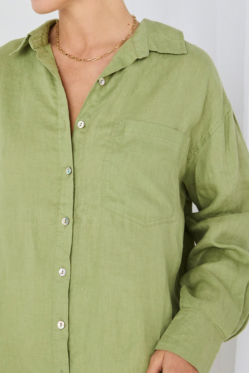 model wears green linen shirt