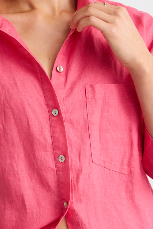 model wears a pink linen shirt 