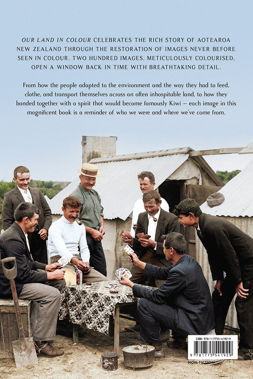 Back cover of a book titled 'Our Land in Colour' featuring a large historical photograph of Māori men gathered around a corrugated metal hut, with descriptive text at the top and a barcode at the bottom.