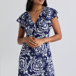 model wears a navy print midi dress