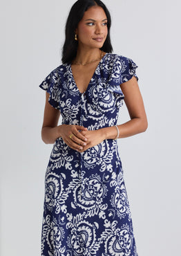 model wears a navy print midi dress