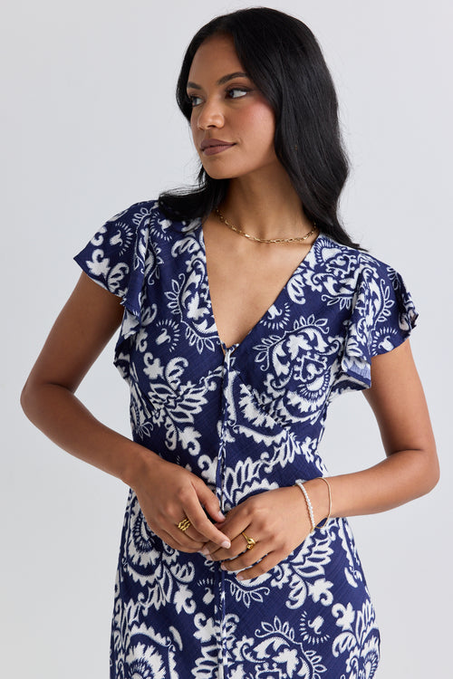 model wears a navy print midi dress