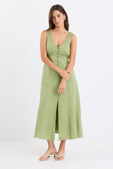Woman wears a green button down front dress