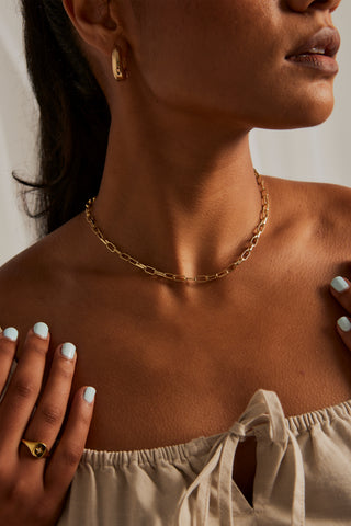 model wearing paperclip gold necklace