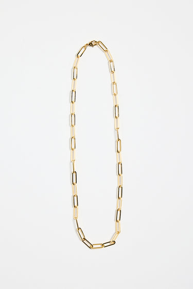 gold-plated brass paperclip chain necklace with elongated links, photographed flat on a white background.