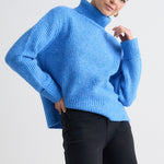 model wears a Blue Knit Jumper