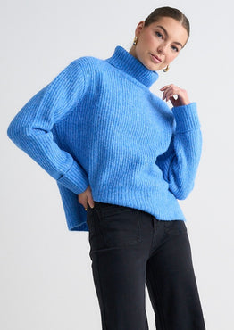 model wears a Blue Knit Jumper