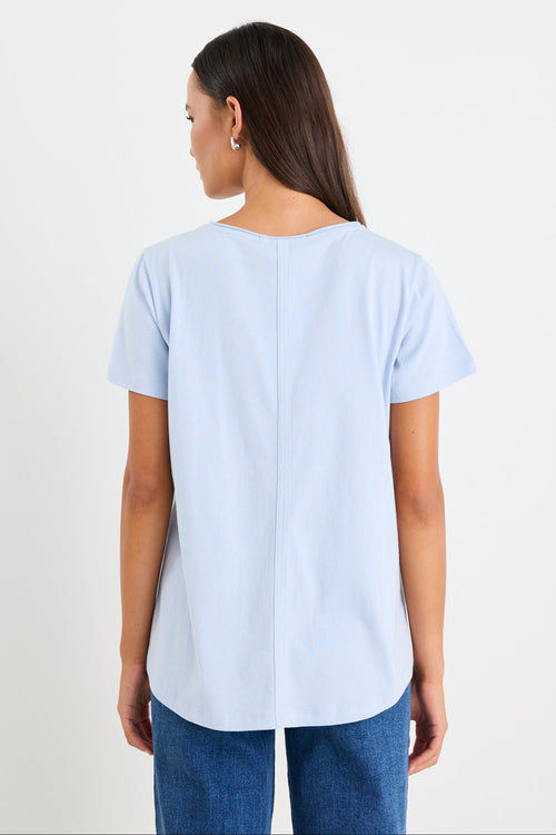 Woman wearing a blue cotton v neck top