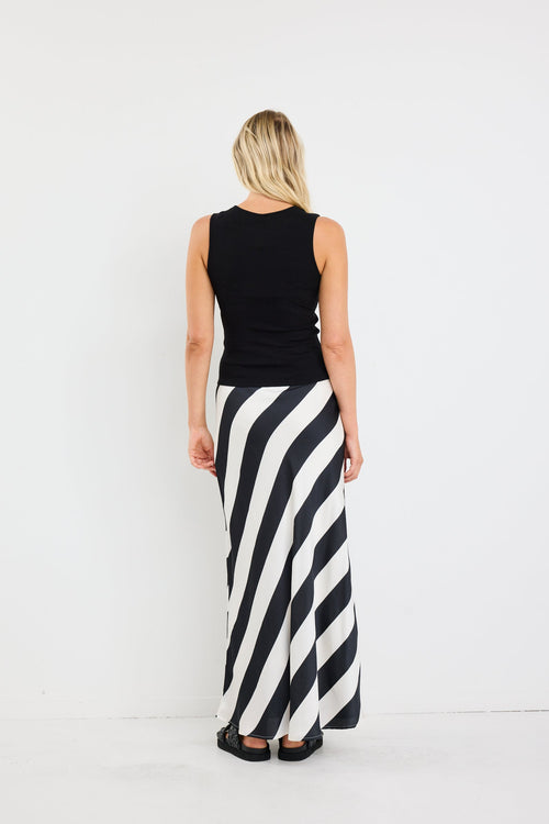 Women wearing black white stripe maxi skirt