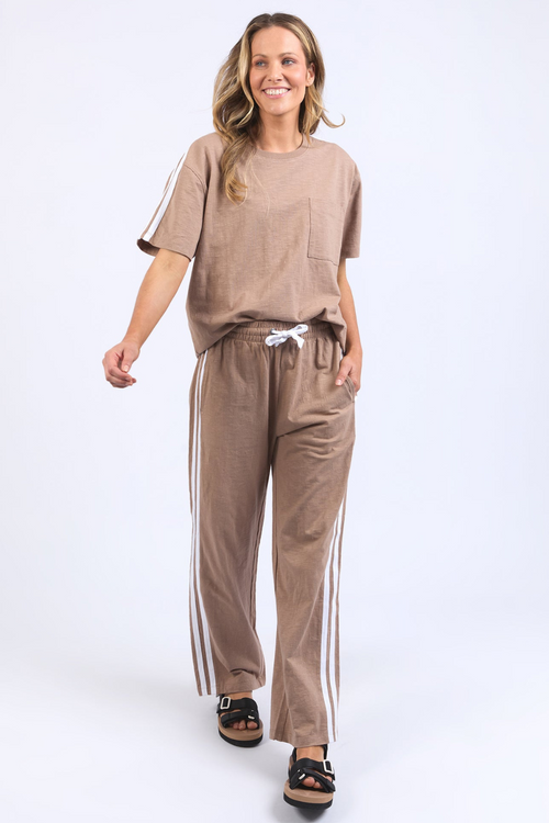 model wears casual brown pants and top set