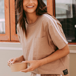 model wears brown tee shirt