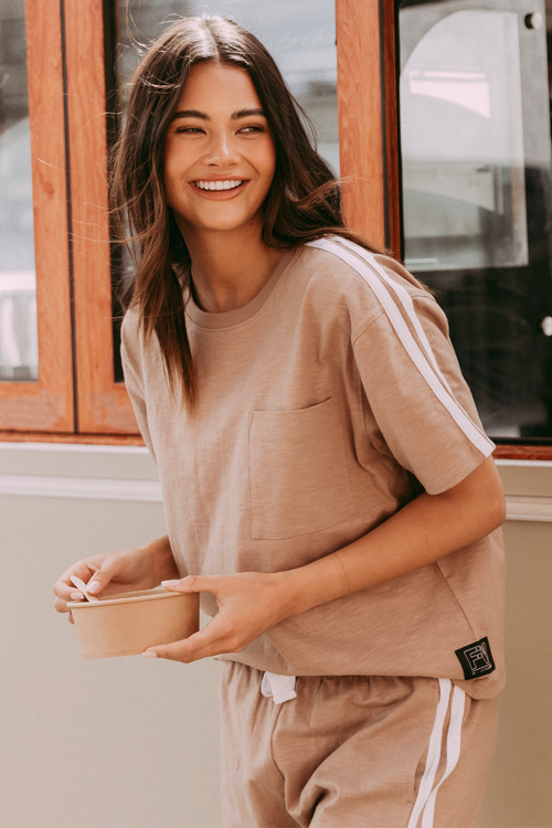 model wears brown tee shirt