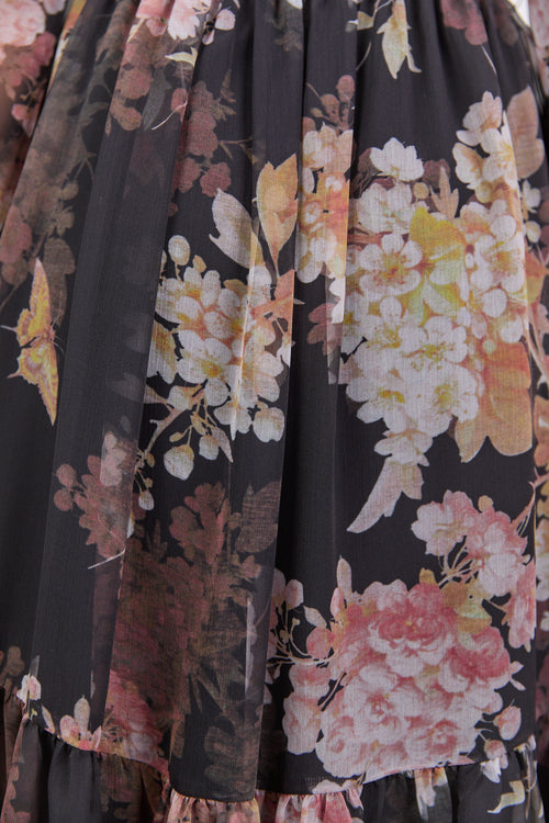 Close-up of a floral patterned fabric with a dark background