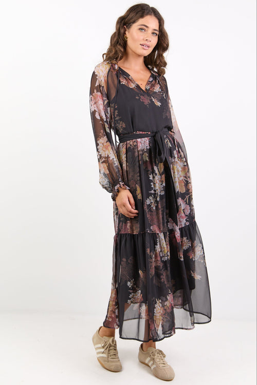 Woman wearing a floral dress on a white background