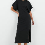 Woman wearing a black dress with a white background