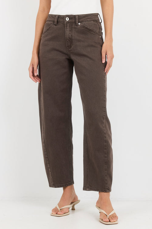 Brown pants worn by a person on a white background