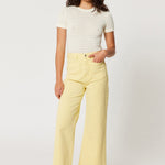 model wears yellow jeans