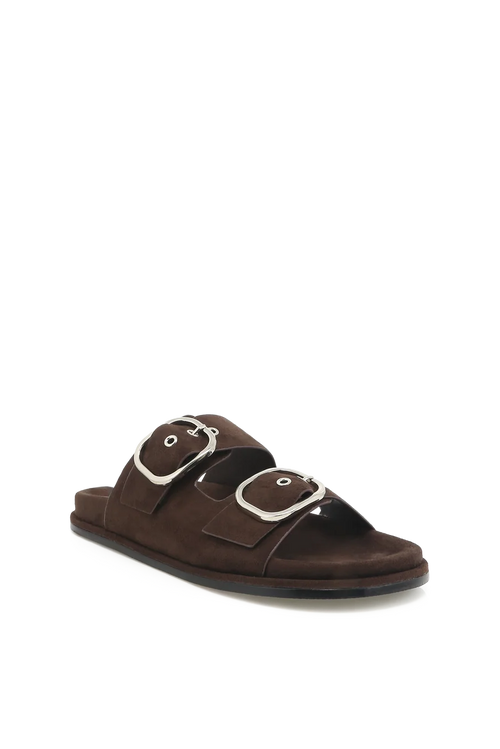 A dark brown double-strap slide sandal with large silver-tone buckle details, shown from a three-quarters angle on a plain white background.