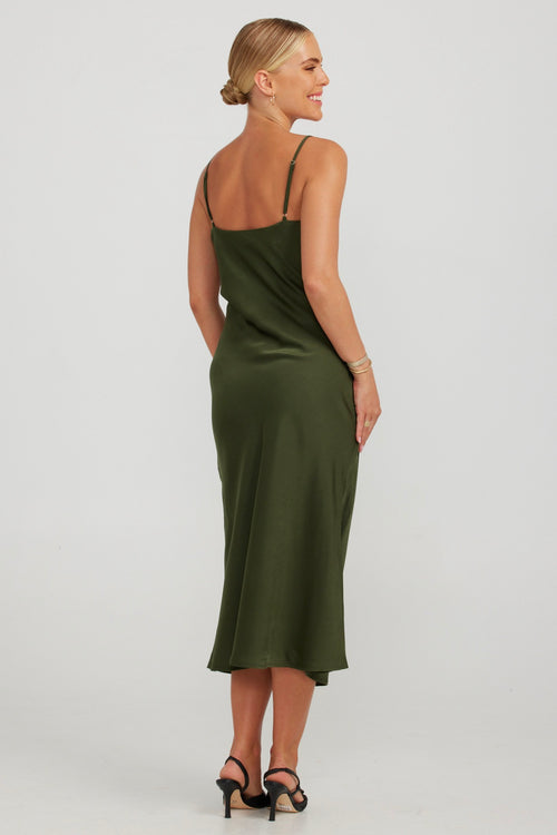 model wears a green slip midi dress