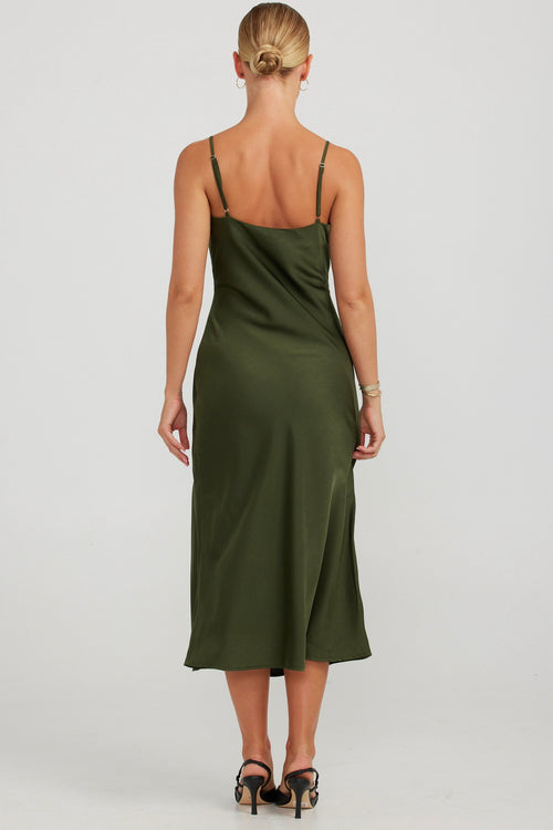 model wears a green slip midi dress