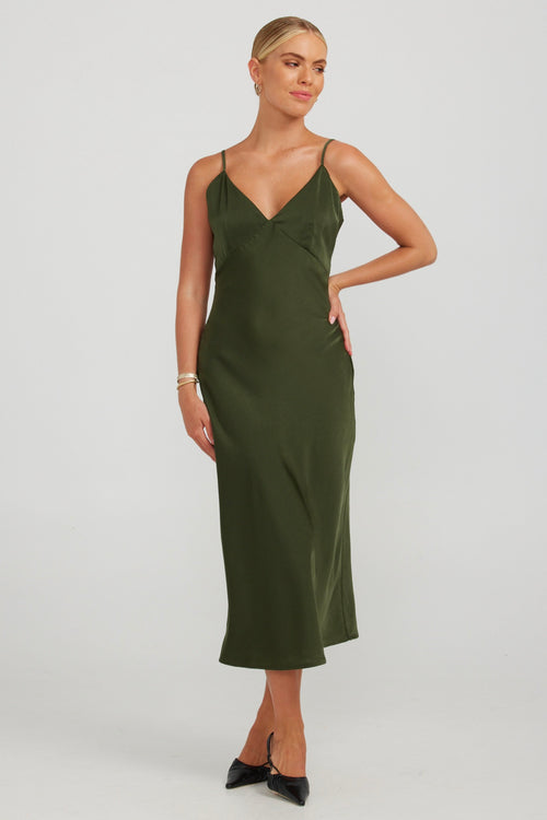 model wears a green slip midi dress